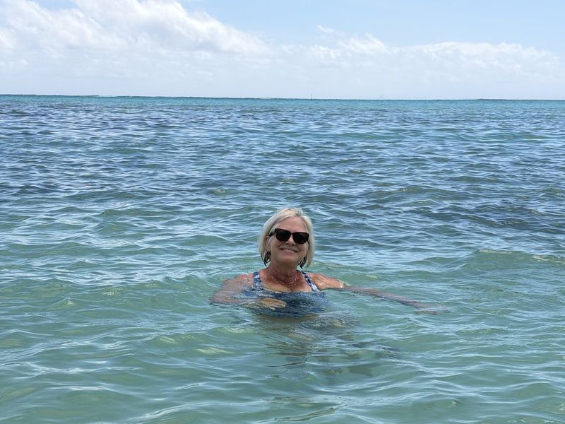 Leigh-Ann floating in clear turquoise water